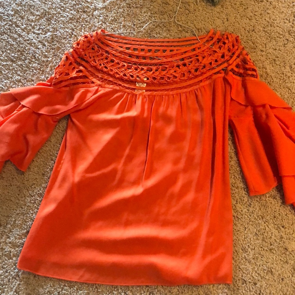 Orange ruffle top